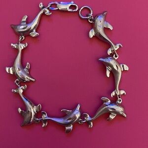 Charming Dolphin Bracelet. Stamped Sterling. 7” long. Beautiful and Shiny.